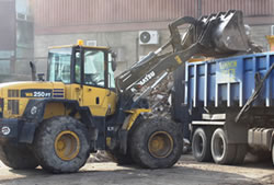 Skip Hire Great Dunmow loading a lorry